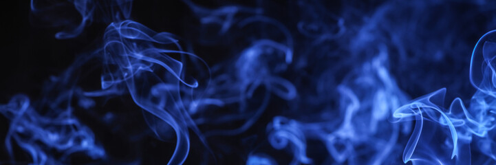 Blue smoke on black background, closeup. Banner design