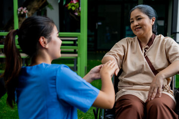 Naklejka premium Close-up mid section of a doctor holding patients hands.