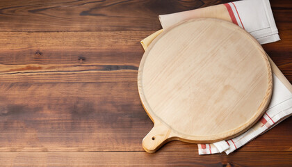 Napkin and board for pizza on wooden desk mockup. Selective focus.