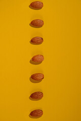 Almonds seed isolated on yellow background