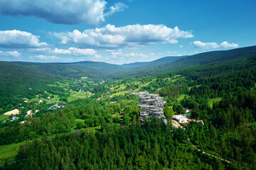 Sky Walk observation tower in Sweradow Zdroj, Poland. Tourist attraction in montains, aerial view. Panoramic view of nature landscape with green forest