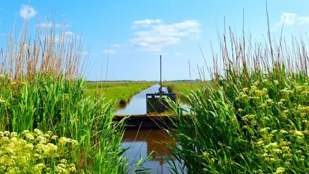 Contactor (hydraulic engineering) Water barrier in the beautiful north German countryside in a moat in northern Germany