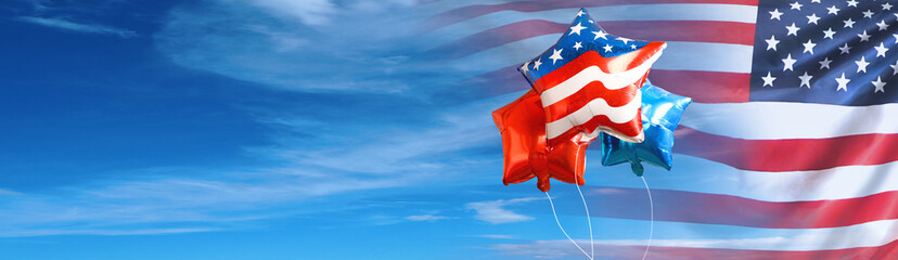 The balloons with USA flag on blue sky background. American holiday concept.