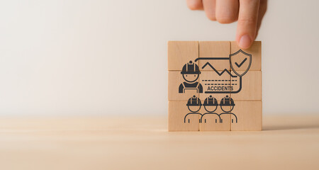 Zero accident and work safety concept. Placing wooden cube with icon of zero accident communication, training, performance. Hazards, protections, regulations and compliance. Working standard process.