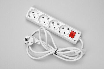 New power strip with switch button on white background, top view