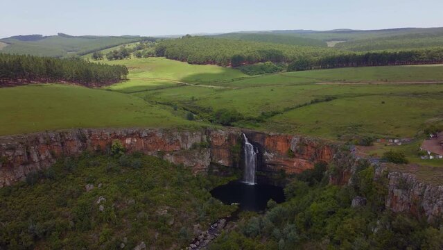 South Africa aerial drone Lisbon Falls waterfalls Sabie cinematic Kruger National Park partially cloudy lush spring summer green stunning river landscape bush forward pan up movement