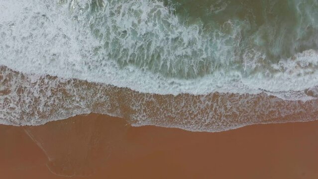 South Africa Still Bay empty beach aerial drone cinematic beach small surf town Garden Route Jeffreys Bay  waves crashing aqua blue green ocean late morning afternoon top down left movement