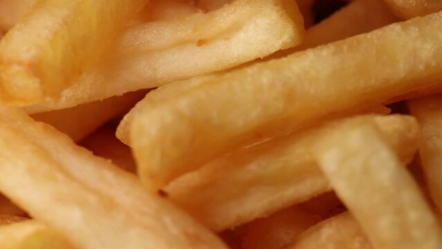 Delicious french fries , rotation in circle. Frires (fast food) Turning. selective focus	
