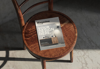 Magazine or book cover Mockup on wooden chair in room