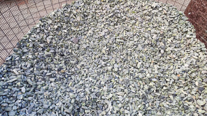 Gravel texture. Fine gray stone gravel. Natural textural background. Copy space and pattern