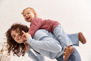 quality time, happiness, balancing between work and life, cheerful woman with excited baby girl on...