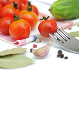 Canning vegetables. Fresh cucumbers and tomatoes isolated on white background.