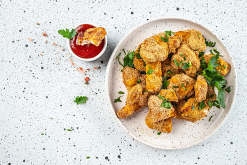 crispy homemade baked chicken nuggets on a light background, banner, menu, recipe place for text,...