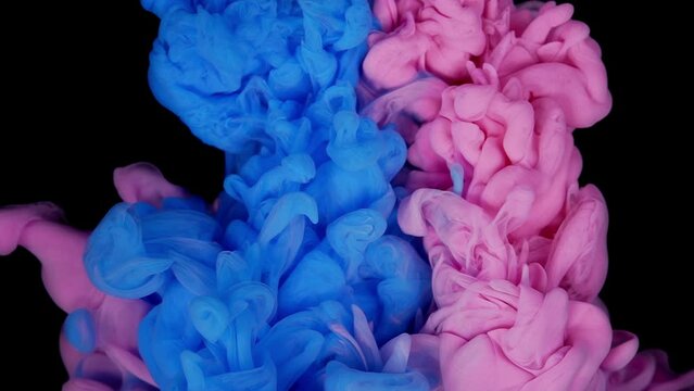 Magic luid art Cloud of silky ink in water isolated on black background. Colorful ink in water, ink drop. Purple, blue, pink