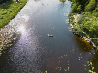 Rubber kayak on the river on a summer day, photo from above.