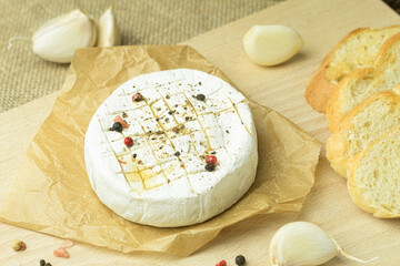 Close-up of French camembert cheese ready to be baked in the oven
