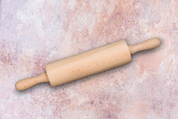 New wooden cooking rolling pin on desk