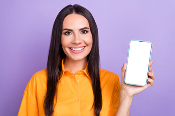 Photo of young brunette hair woman wear orange shirt hold smartphone menu showing qr code promo...