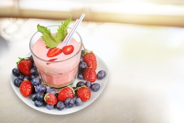 Delicious berry smoothie drink in glass.