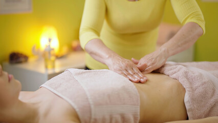 Obraz na płótnie Canvas Calming and Rejuvenating Massage for Women Stomach