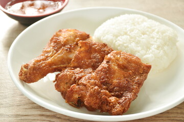 crispy chop fried salty chicken tight and drumstick eat with sticky rice on plate dipping sweet chili sauce
