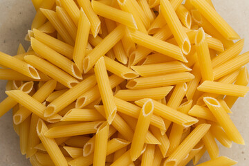 Italian pasta on table with tomatoes, pepper and different species
