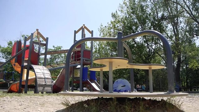 Empty Children's Carousel Spinning in the Playground