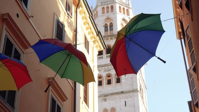 Colorful Umbrellas Hanging on a Wire in the Street of an Old European City