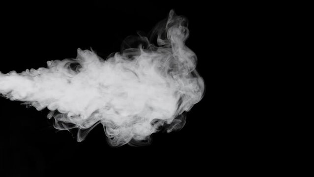 Water Vapor. White Jet Of Vapour Steam Under Pressure On Black Background, Micro Drops Of Hot Water Are Sprayed In Air, Dry Smoke Fog
