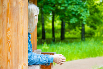 Moscow, Russia - June 05, 2023: girl standing on the summer veranda