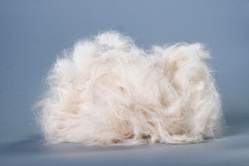 Close up of Bunch of dog hair fur after brushing and grooming. The concept of animal care
