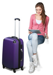 Pretty young woman with purple travel bag isolated on white background