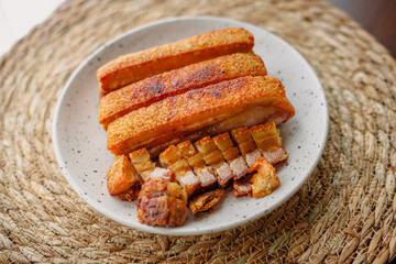 crispy fried pork belly in a plate