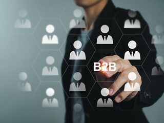 Businessman pressing on B2B Business to Business Exchange Dealing with other business organizations