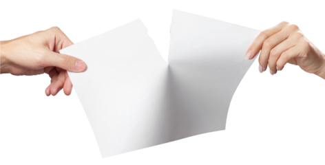Hands tearing a sheet of white A4 paper in half, cut out