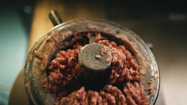 minced meat crawls out the meat grinder