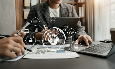 Person typing laptop computer and tablet with SDK icon on virtual screen. SDK Software development kit programming language technology concept in office.