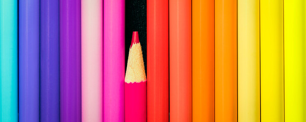 Pencil crayons in vibrant colors in a row; Studio