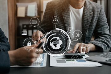 Person typing laptop computer and tablet with SDK icon on virtual screen. SDK Software development kit programming language technology concept in office.