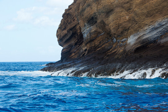 The sea, washing down the back side of the rock face of the crescent shaped, volcanic islet of Molokini in the Alalakeiki Channel off of Maui in Maui County; Maui, Hawaii, United States of America