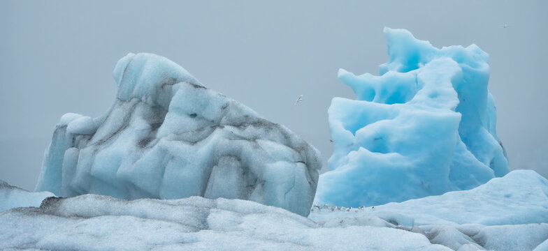 Icebergs and amazing, blue ice-formations of the J&ouml;kuls&aacute;rl&oacute;n Glacier Lagoon, South Iceland