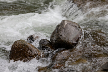 Close-up of water cascading over rocks; Iao Valley, Maui, Hawaii, United States of America