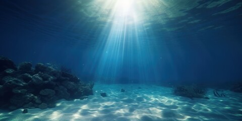 Empty blue underwater with sunlight shine to sand sea floor, deep ocean
