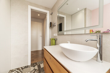 Bathroom with a white resin shell sink