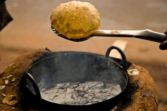 Fresh fried poori, or puri, on the streets of India; Karaikudi, Chettinad, India