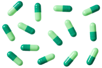 Green capsules isolated on white background, top view.