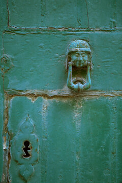 Close view of an old door with knocker and keyhole; Valletta, Malta Island, Republic of Malta