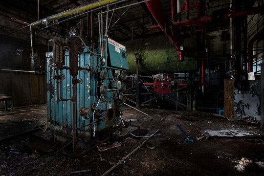 Machinery and debris in an abandoned elastic factory; Centrelea, Nova Scotia, Canada
