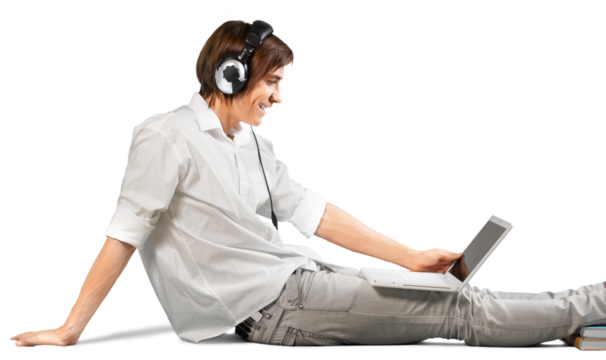 College aged student using a laptop with headphones on - Powered by Adobe