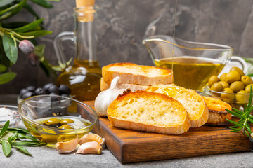 Italian ciabatta bread with olives, garlic, parmesan and rosemary on a dark marble background. Tasty food. Aperitif. Place for text. copy space. Delicacy. Bon appetit.